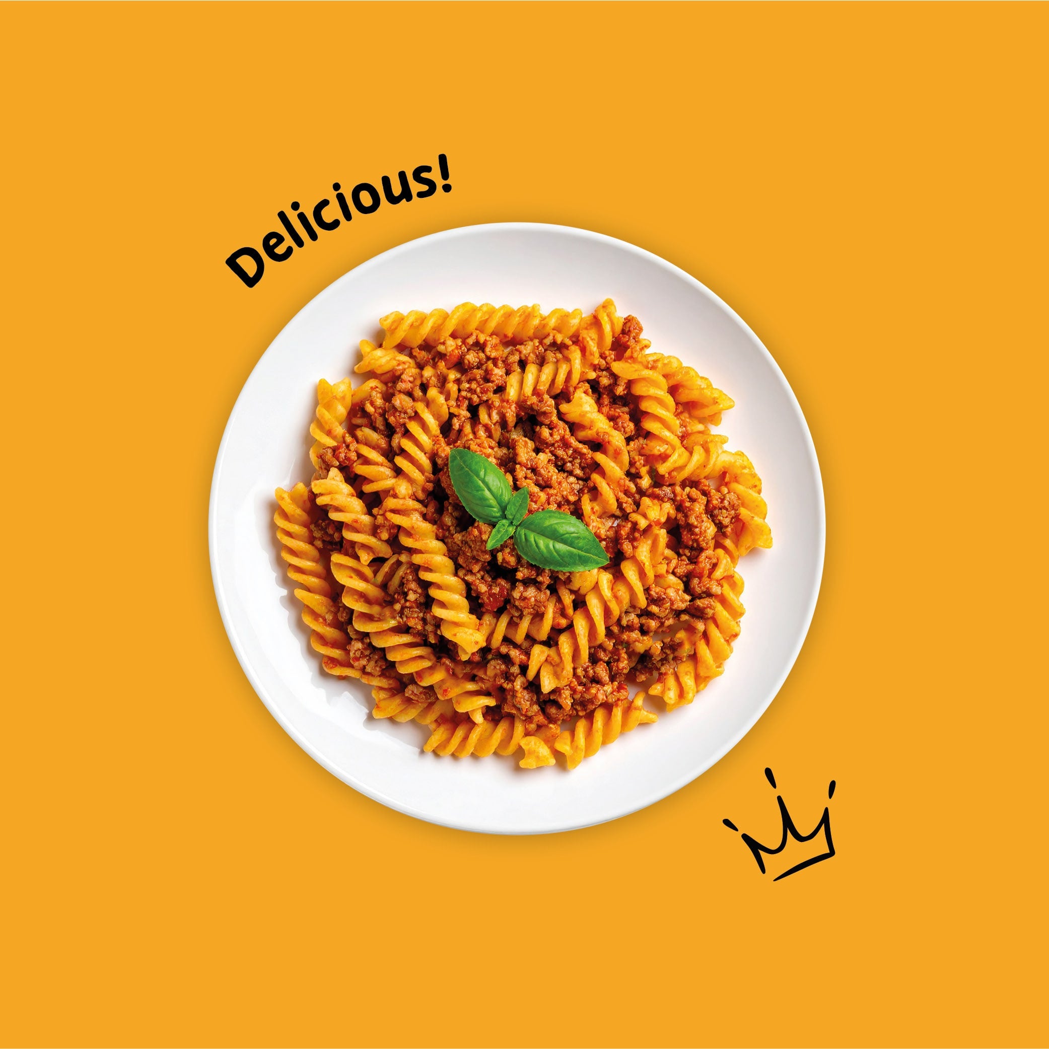 Beef Bolognese Pasta dish with tomato sauce and basil leaves on a white plate against an orange background