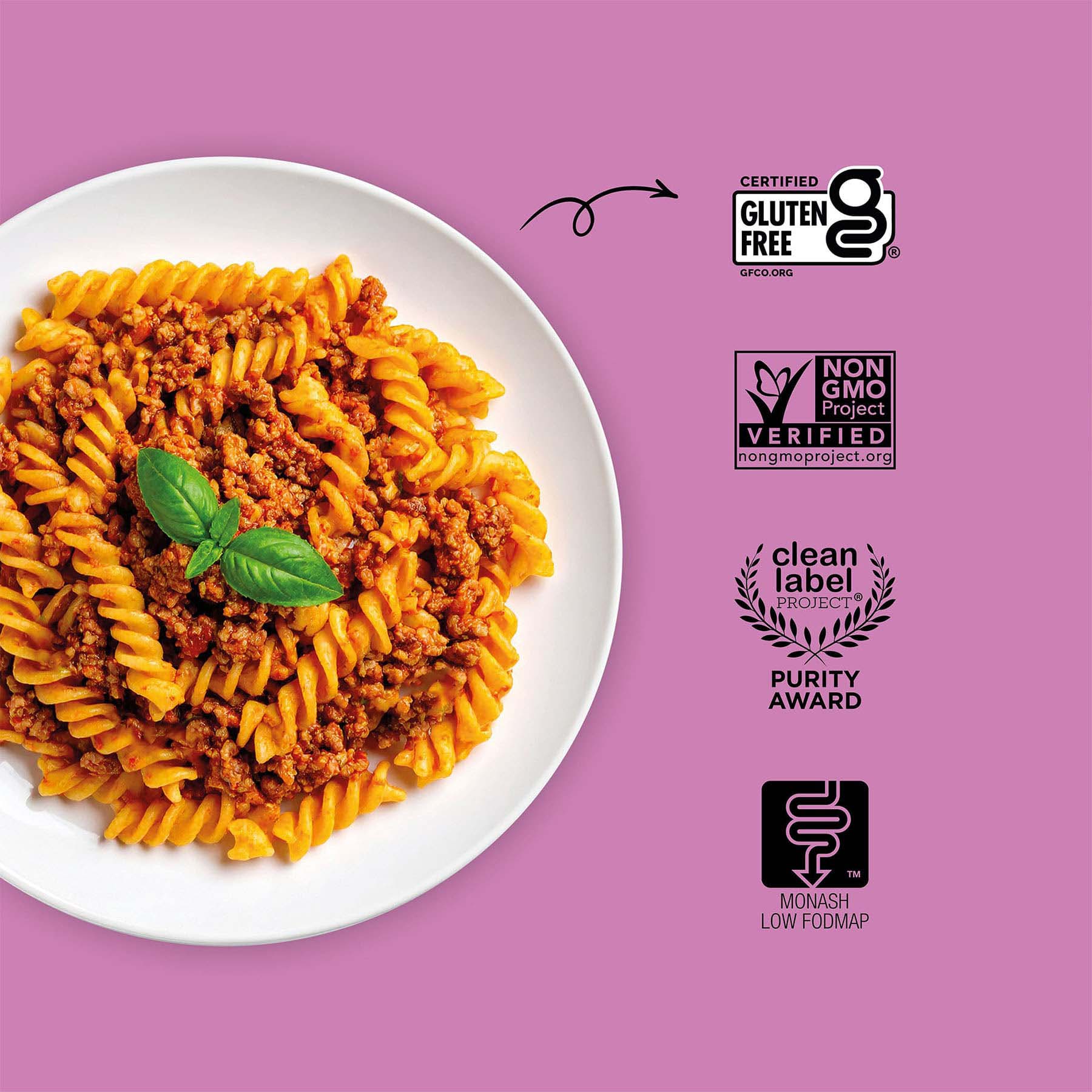 Plate of pasta with a purple background featuring certification logos.